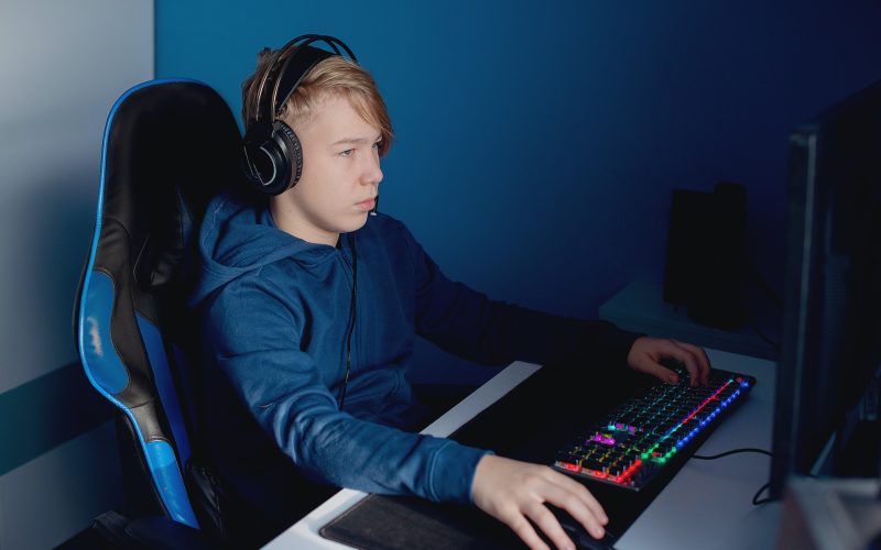 Young gamer playing online video games